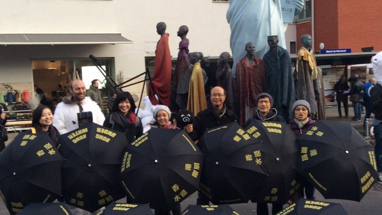 Delegates of Hong Kong NGOs attending the Paris Climate Talks call for action on climate change.
