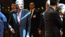 Chief Executive Leung Chun-ying and Financial Secretary John Tsang Chun-wah do not see eye to eye at a reception. They clash over whether to take questions from four lawmakers whose status is the subject of a judicial review filed by the Leung administration.