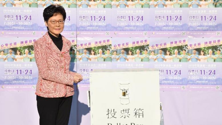 Former chief executive Carrie Lam casts her vote in the 2019 District Council elections.