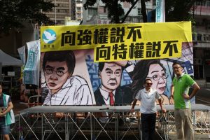 Democrats ridicule the alleged abuse of powers by Chief Executive Leung Chun-ying at the July 1 rally.