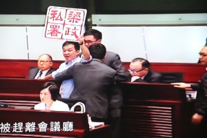 Pan-democratic legislator Chan Chi-chuen stages protest at Chief Executive's Question Time at Legco.