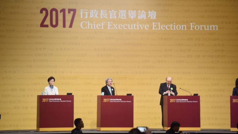 Three candidates vying for the post of Chief Executive attend the Election Forum hosted by the Election Committee Sunday night.