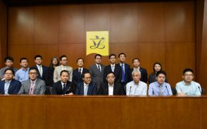 Pan-democrat legislators stand united to defend Kenneth Leung, who faces calls by Chief Executive Leung Chun-ying for him to quit a Legco probe into the UGL case.